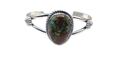 Cuff with 2 bar half round with 1" x 3/4" oval shaped genuine #8 Mine turquoise stone with wire bezel and peyote button in satin finish.  Cuff measures 5" with 1 1/4" opening.  Native American made.