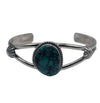 Cuff with 2 bar half round with 3/4" x 5/8" oval shaped genuine Pilot Mountain turquoise stone with wire bezel and peyote button in satin finish.Cuff measures 5" with 1 1/4" opening.Native American made.